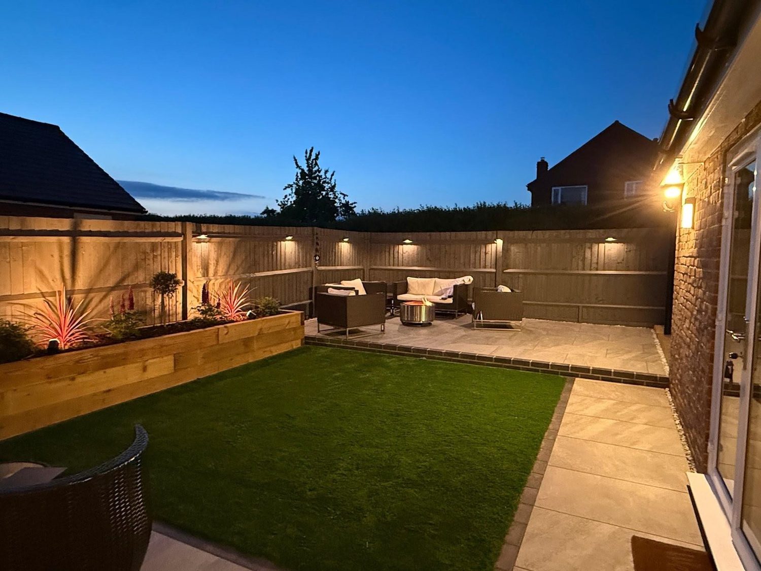 Etonic garden terrace lit at dusk